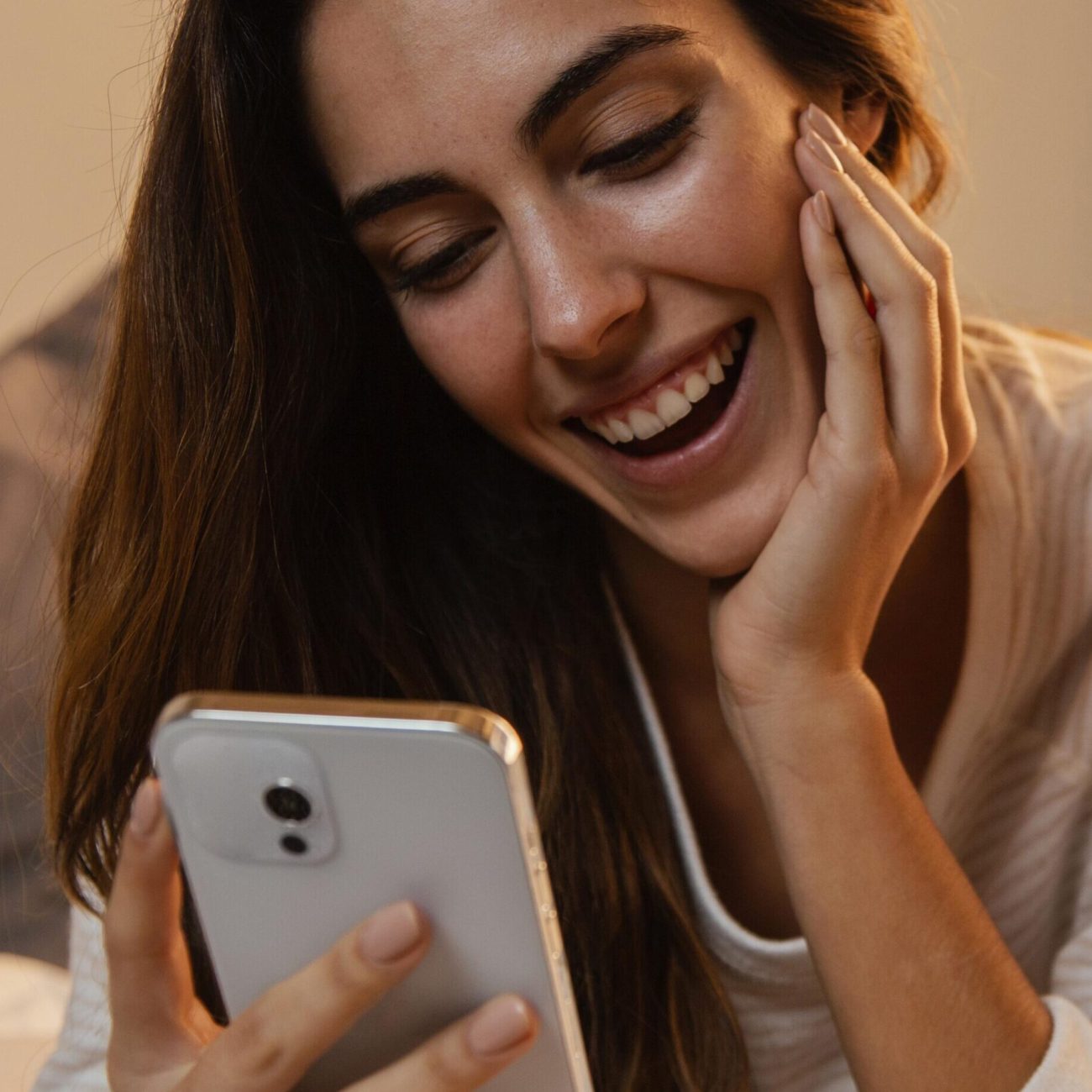 front-view-woman-using-smartphone-home